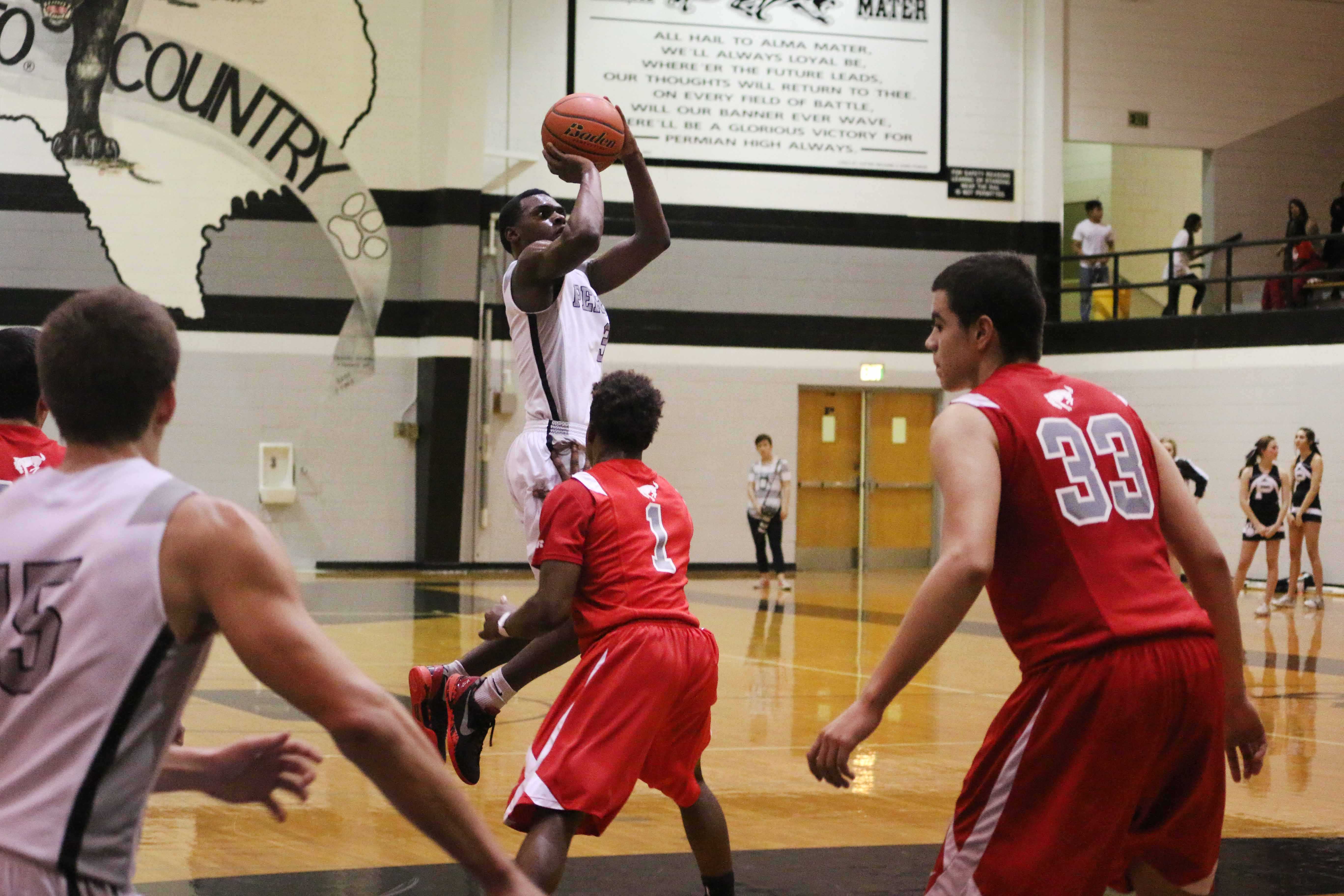 Senior Robert Thomas goes up for a mid-range jumper against OHS in their last home game. Permian defeated OHS 79-53.
Photo by Hannah Silvas.