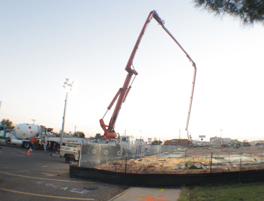 Members of the Lee Lewis Construction company pours concrete for the foundation for the new Academic Wing. They began work that morning at 4 a.m. Photo by Michael Flax