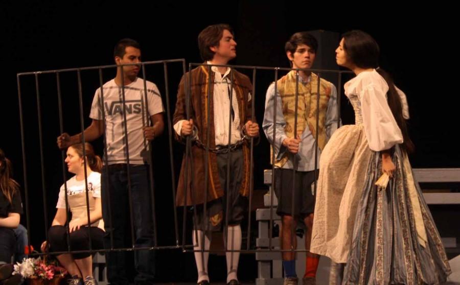 Junior Mariana Vizcarra and Senior Alex Quezada in mid-argument while Senior EddyRay Martinez and Junior Eric Serrato insure that Quezada's character stays in jail.  