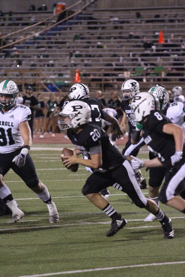 Quarterback senior Harper Terry runs for out-of-bounds to gain a few yards against Southlake Carroll.