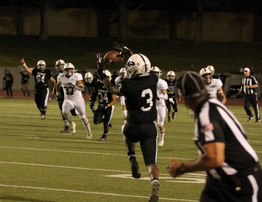 Senior Shy Stephens Deary catches a pass and runs in for a touch down at the Permian vs. Lee Homecoming game.